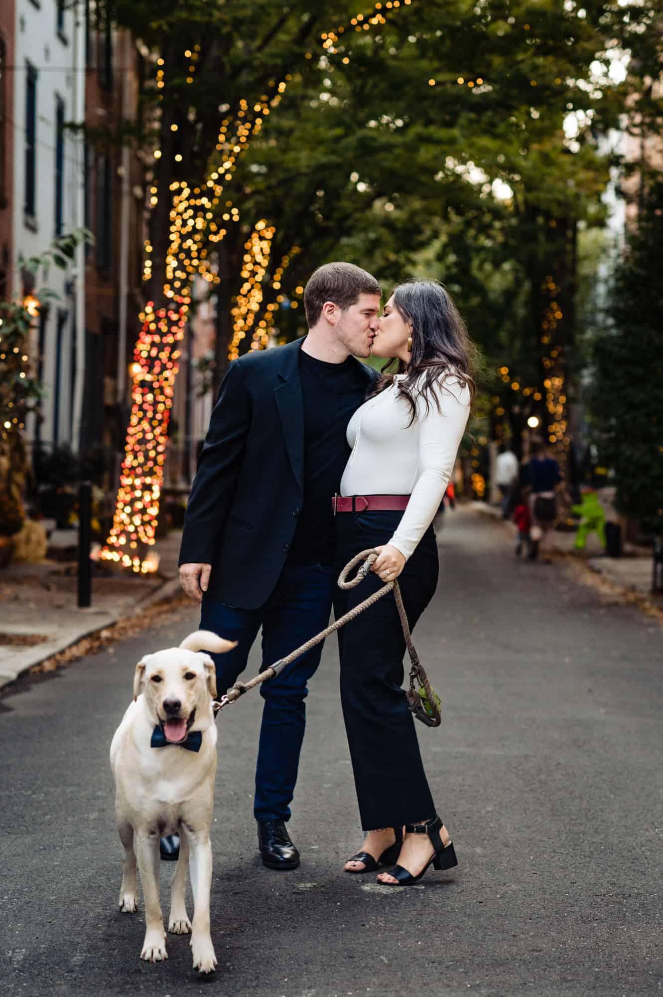 couples kisses for their e-session in center city philly