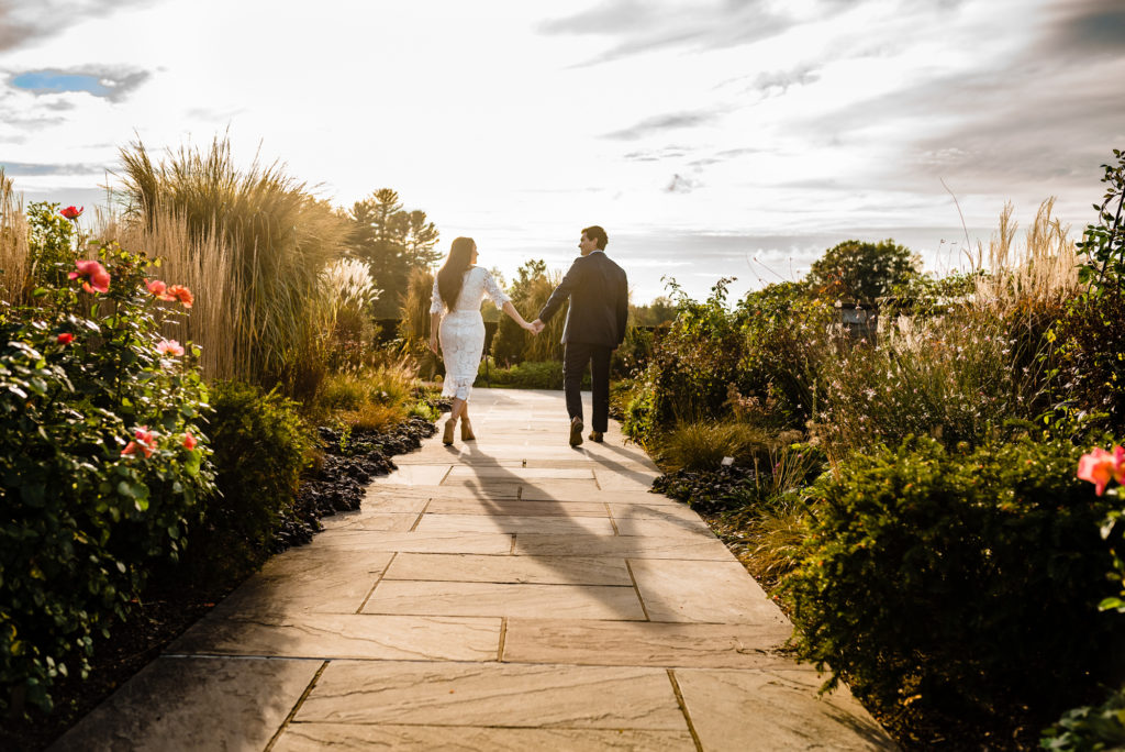 a smiling couple during their Longwood Gardens E-Session