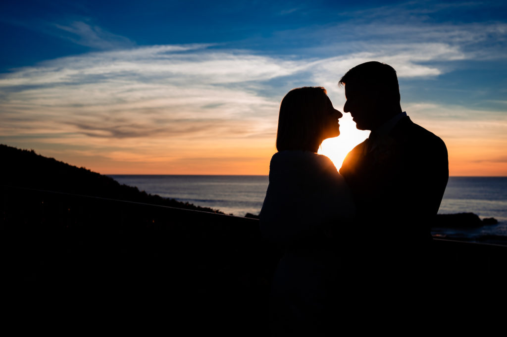 intimate shot of couple after their beach wedding ceremony held outside the Ritz-Carlton Half Moon Bay