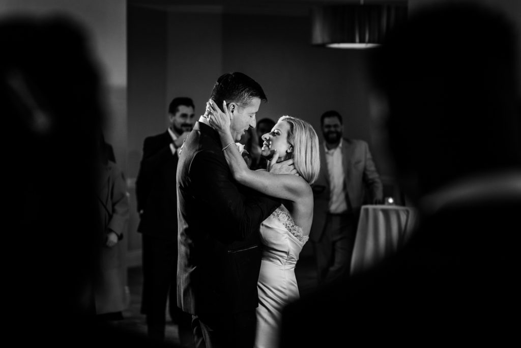 black and white shot of a couple's first dance after the wedding at the Ritz-Carlton Half Moon Bay