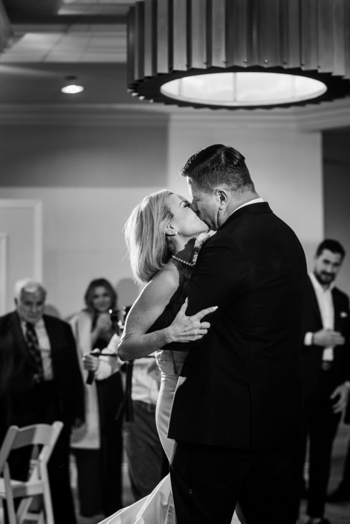 couple kissing during their first dance after the wedding at the Ritz-Carlton Half Moon Bay