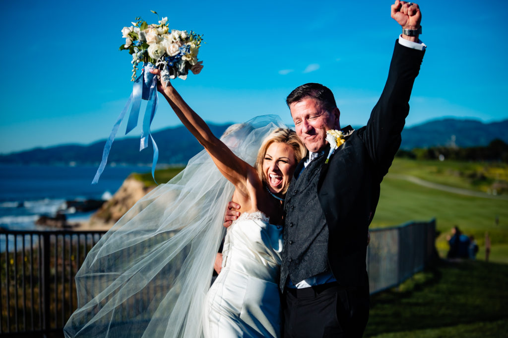 jubilant couple after their beach wedding ceremony held outside the Ritz-Carlton Half Moon Bay