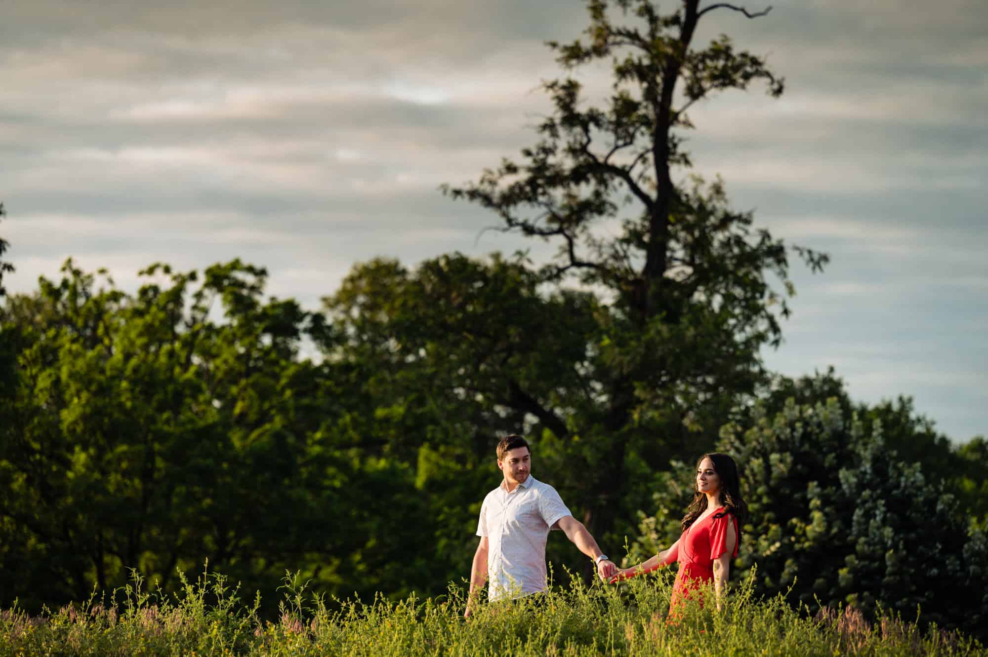 long shot of the couple holding each other's hands