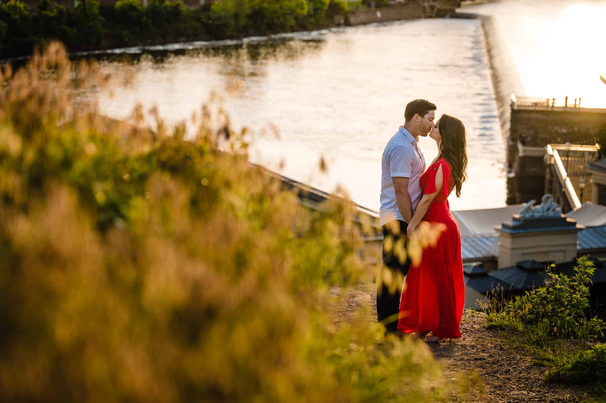 long shot of the couple kissing outside