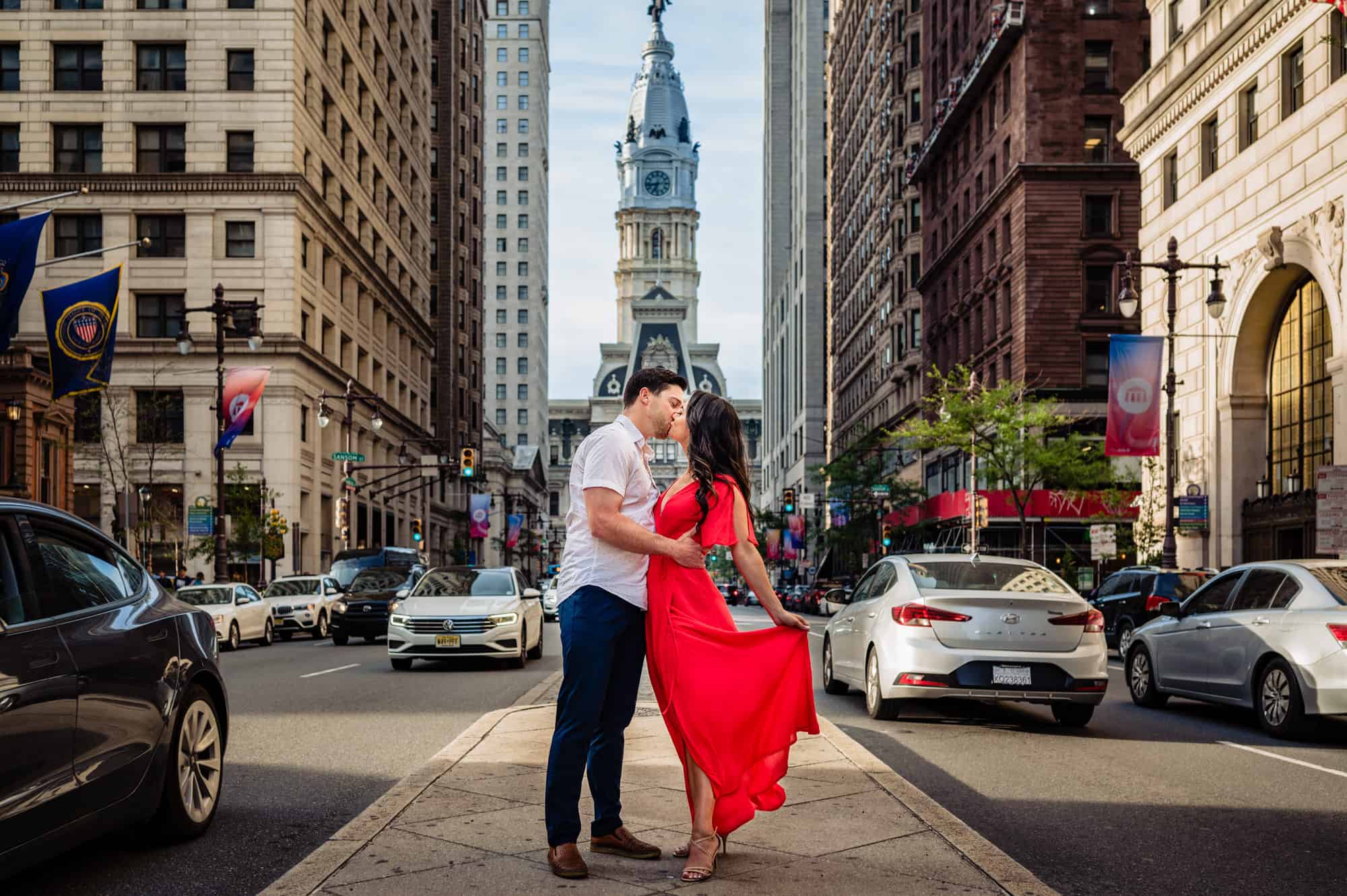 couple kissing outside at their philly art museum e-session captured by philadelphia wedding photographer Ralph Deal