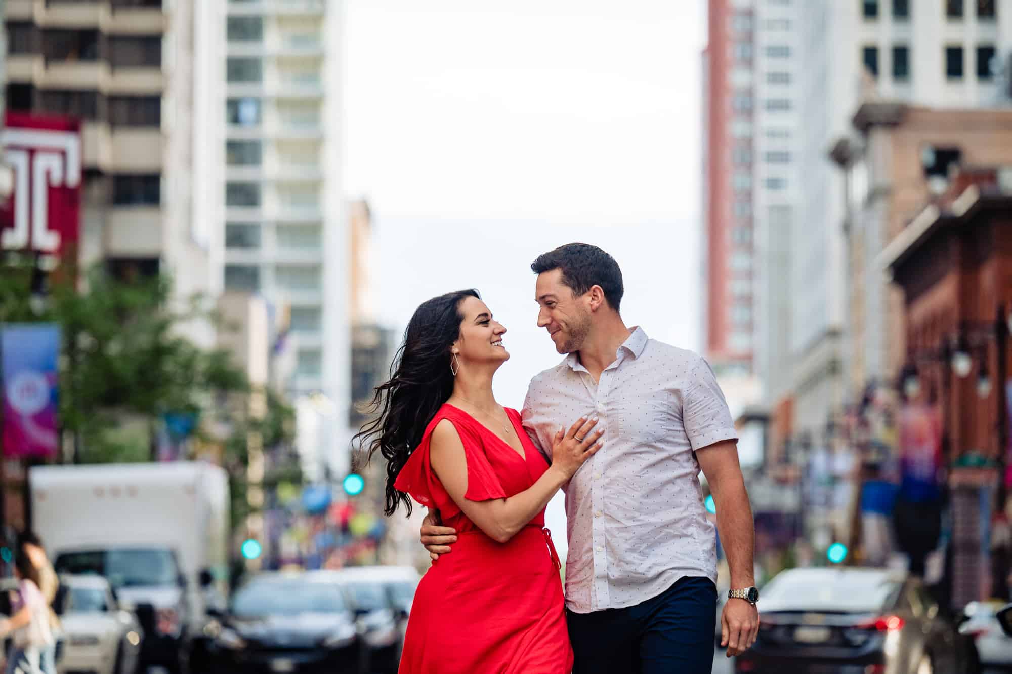 couple posing in the city for their E-Session