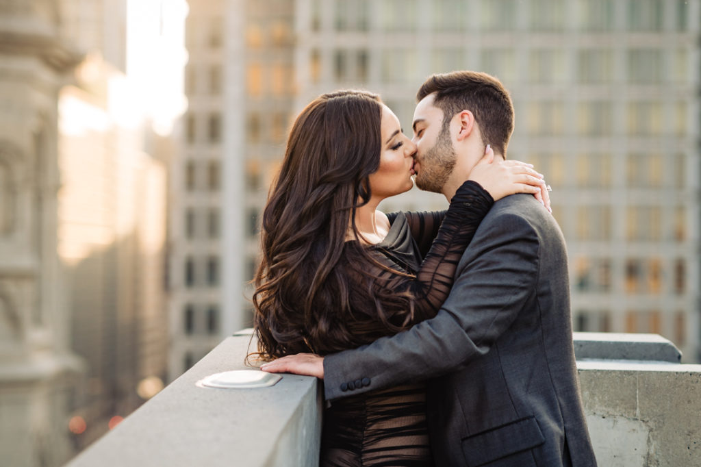 couple kissing during their center city e-shoot