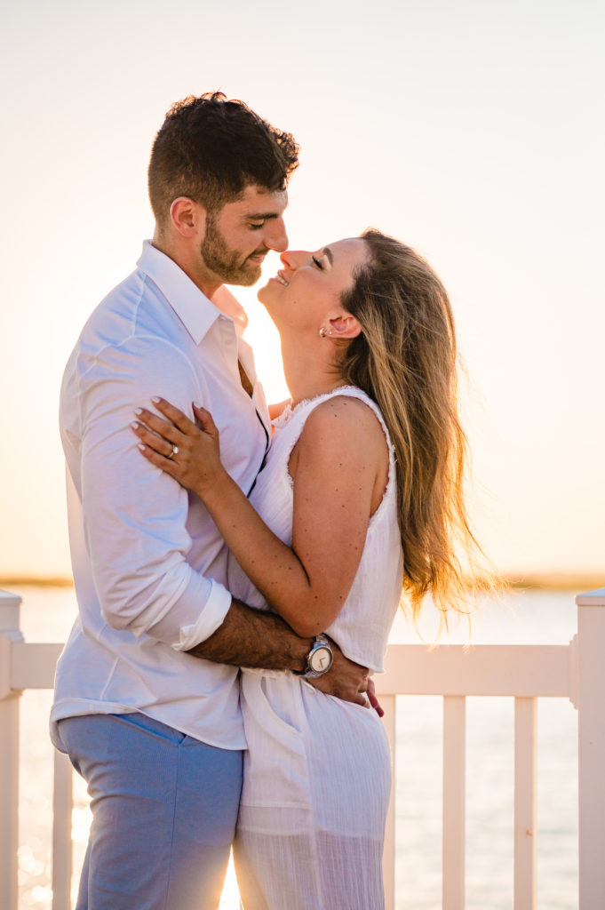 couple going in for a kiss shot in thir margate new jersey e-session
