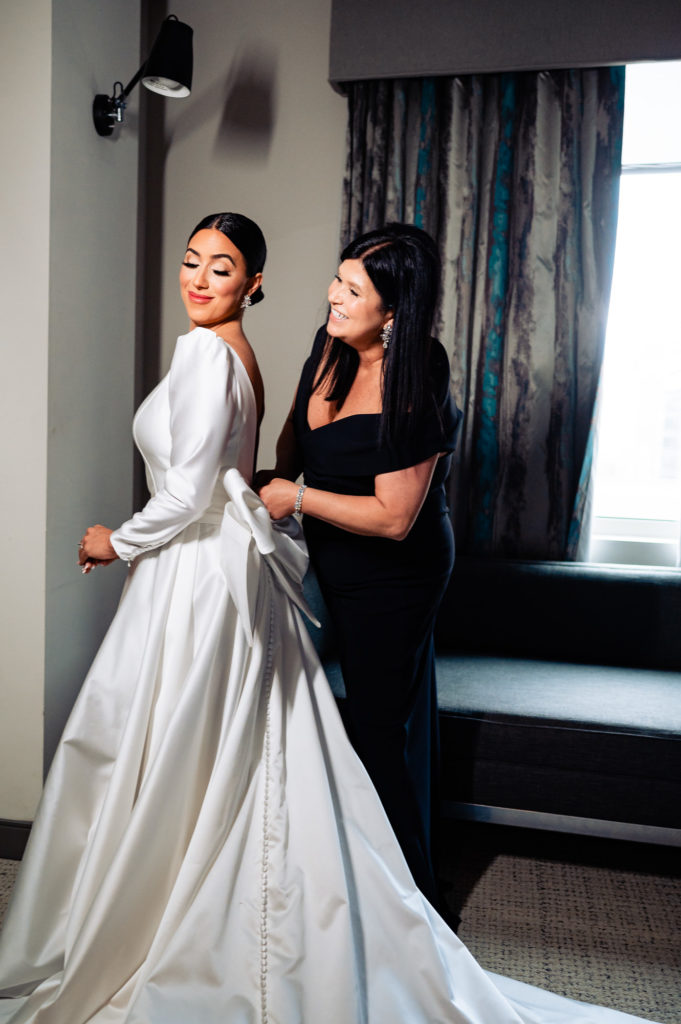 bride poses with maid of honor