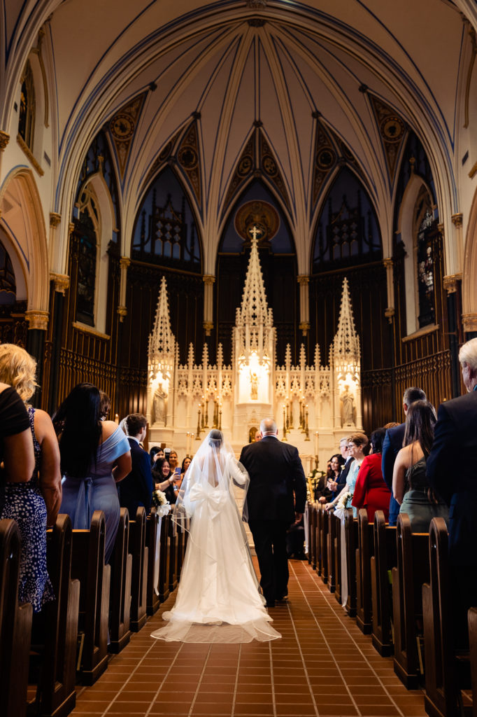 bride walking on the asile alongside with her father