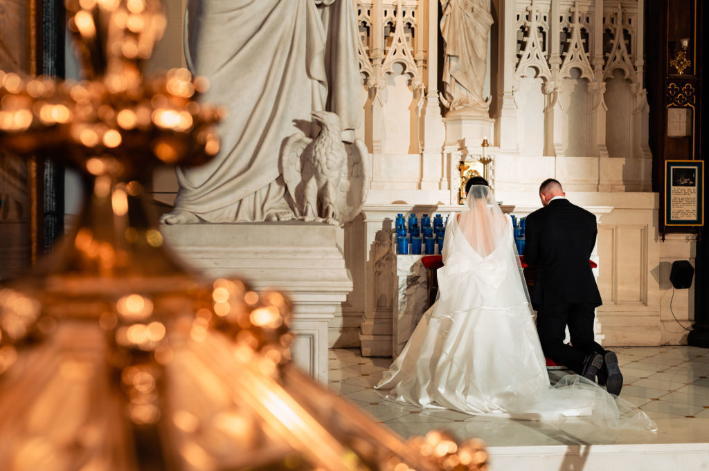 bride and groom on the altar