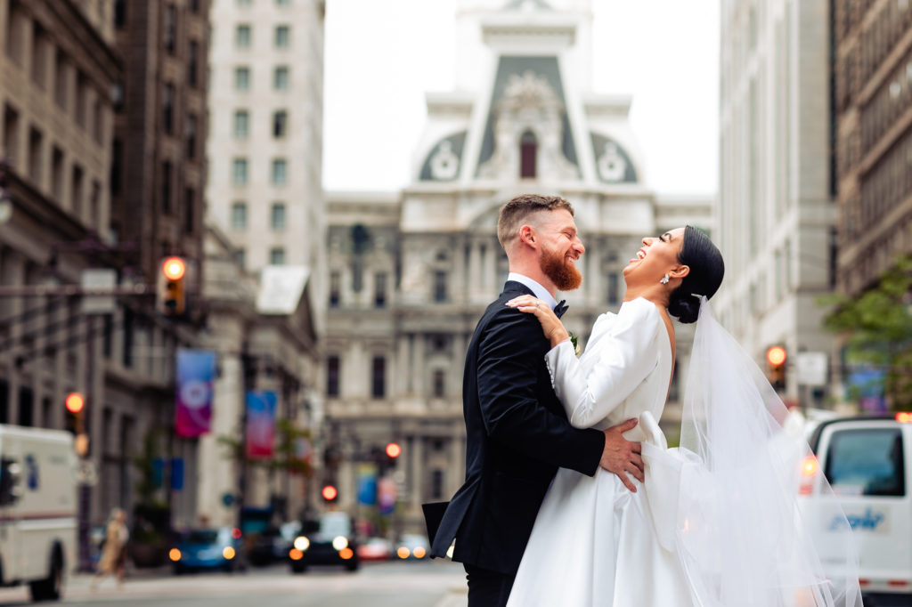 candid shot of groom and bride laughing