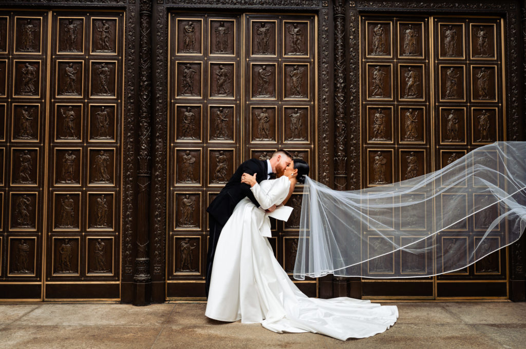 long shot of the bride and groom kissing