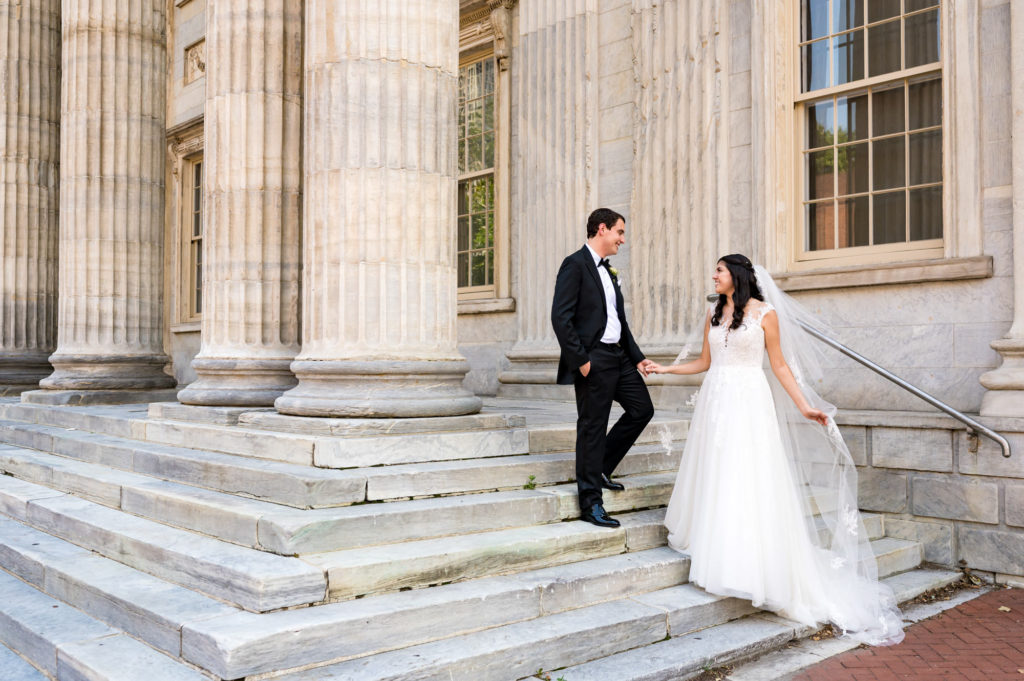 couple is taking a pose before their wedding at the Curtis atrium