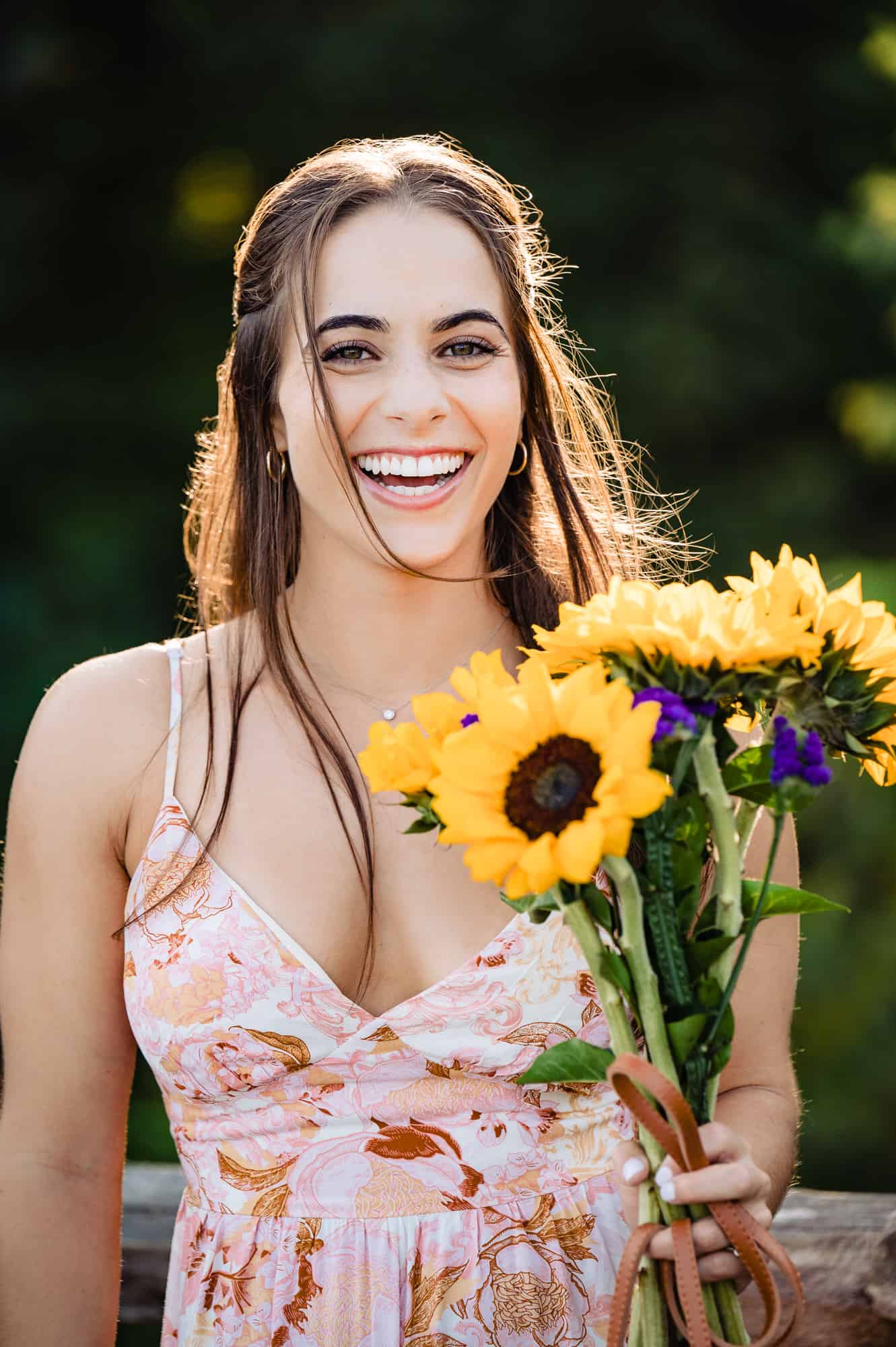 lovely bride to be smiling in front of the camera during her new jersey engagement photoshoot