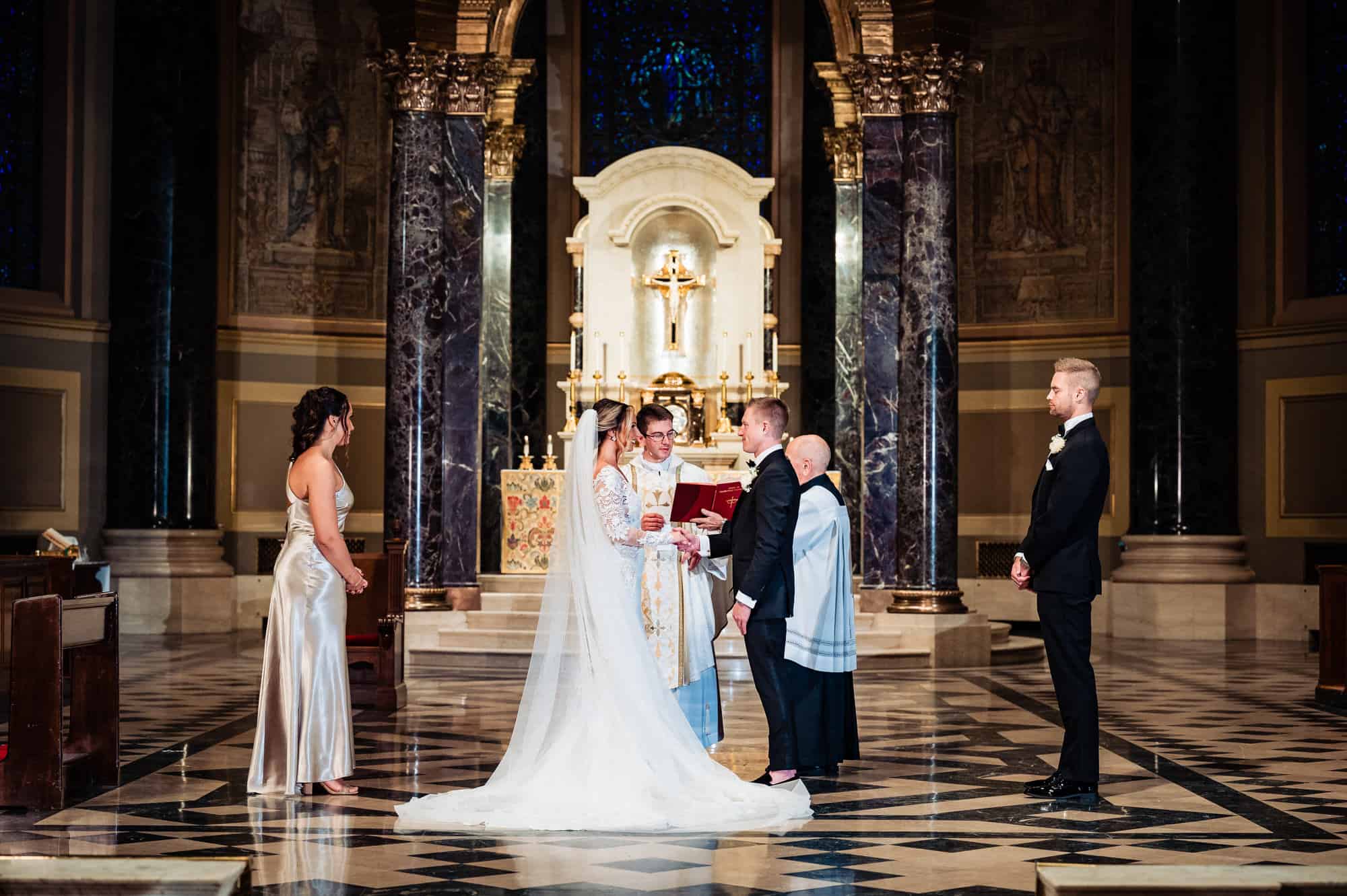 bride and groom in front of the altar