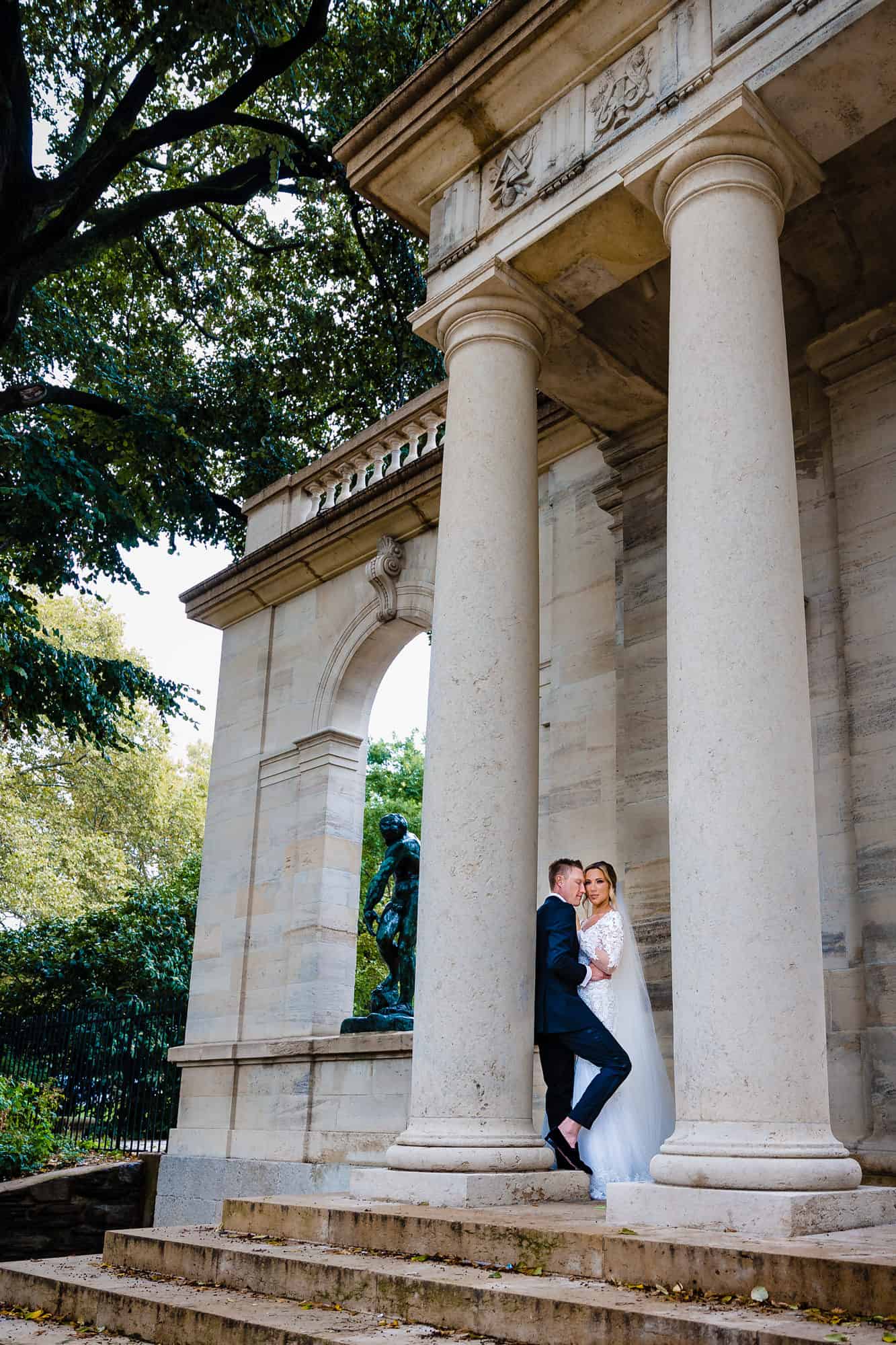 bride and groom posing outside their wedding at the crystal tea room