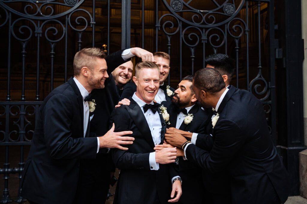 groom and groomsmen being silly