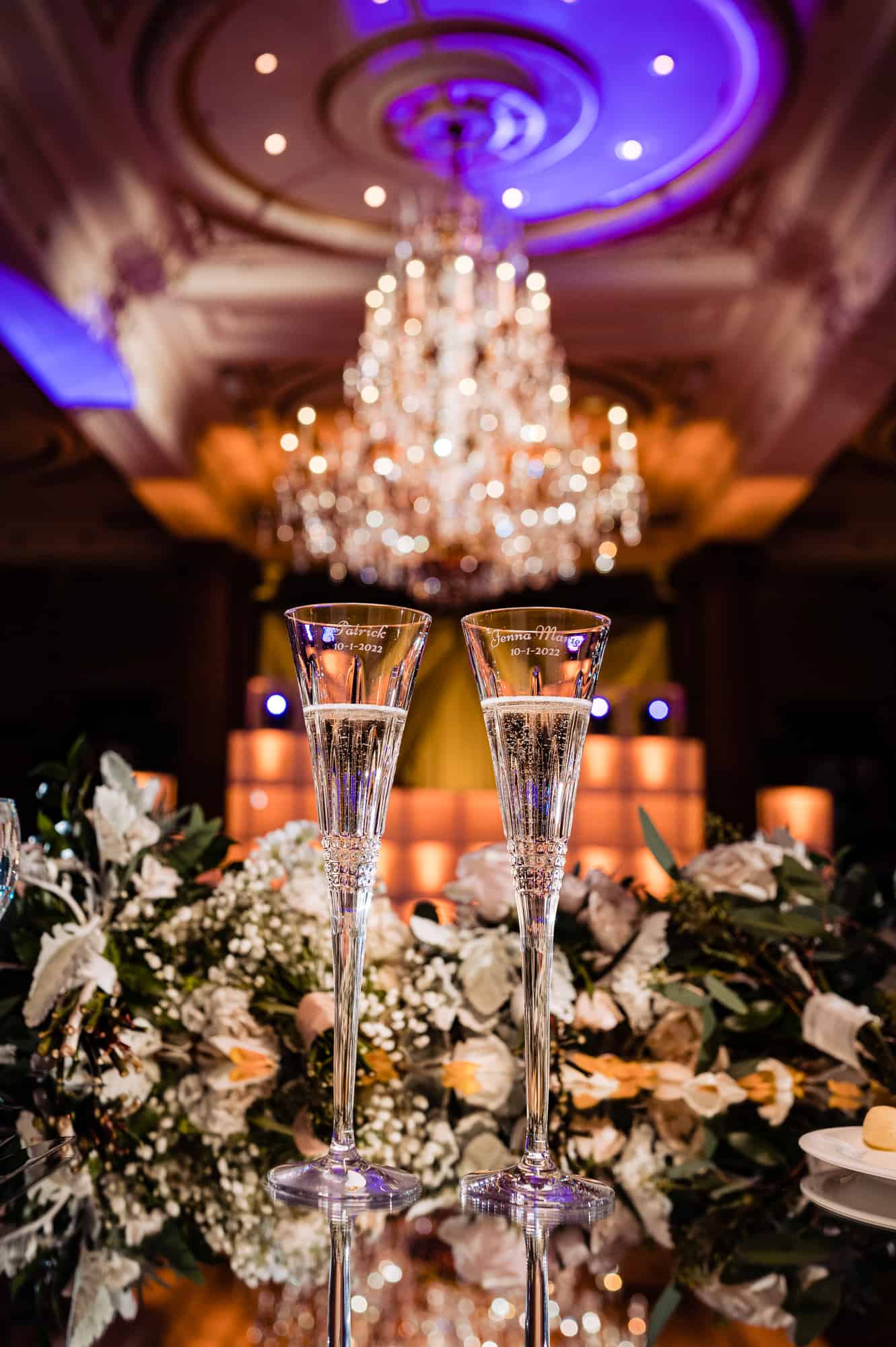 wide shot of the newlywed's wine glasses