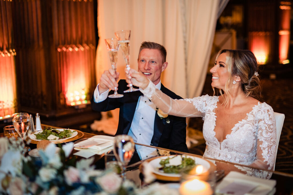 newlyweds clinking their wine glasses