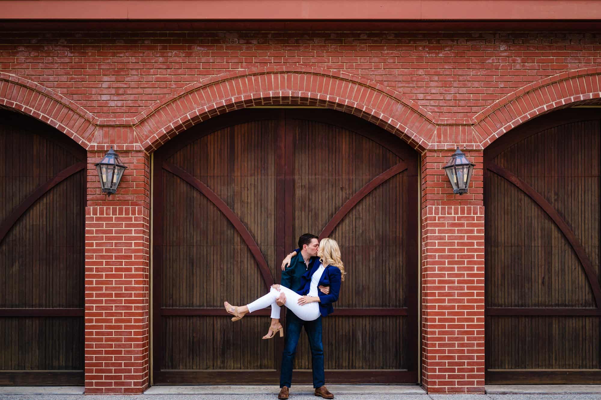 couple taking a pose in an alley in Old City during their old city engagement photoshoot