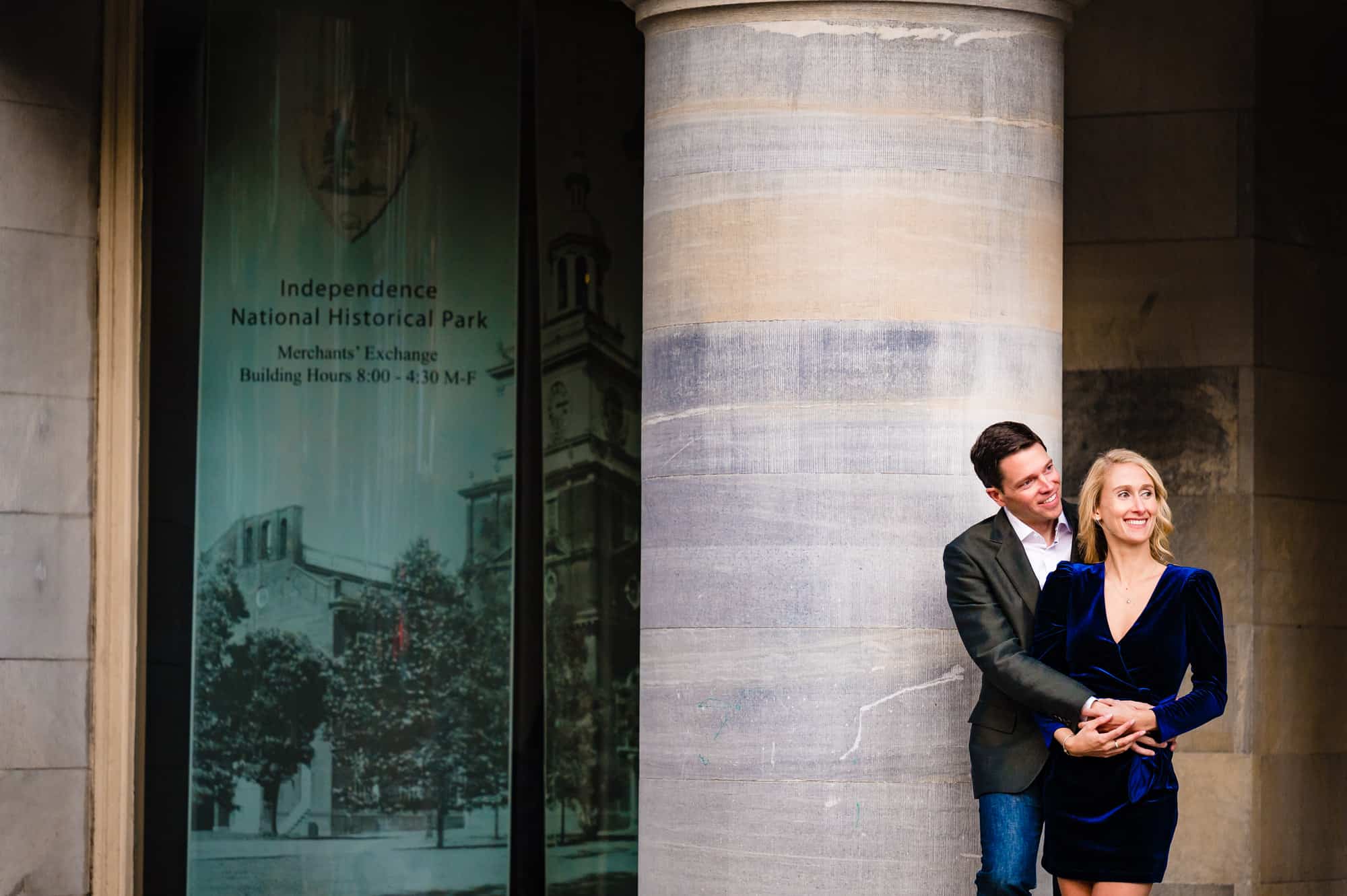 modern couple posing in front of the Merchant Exchange building during their old city engagement session