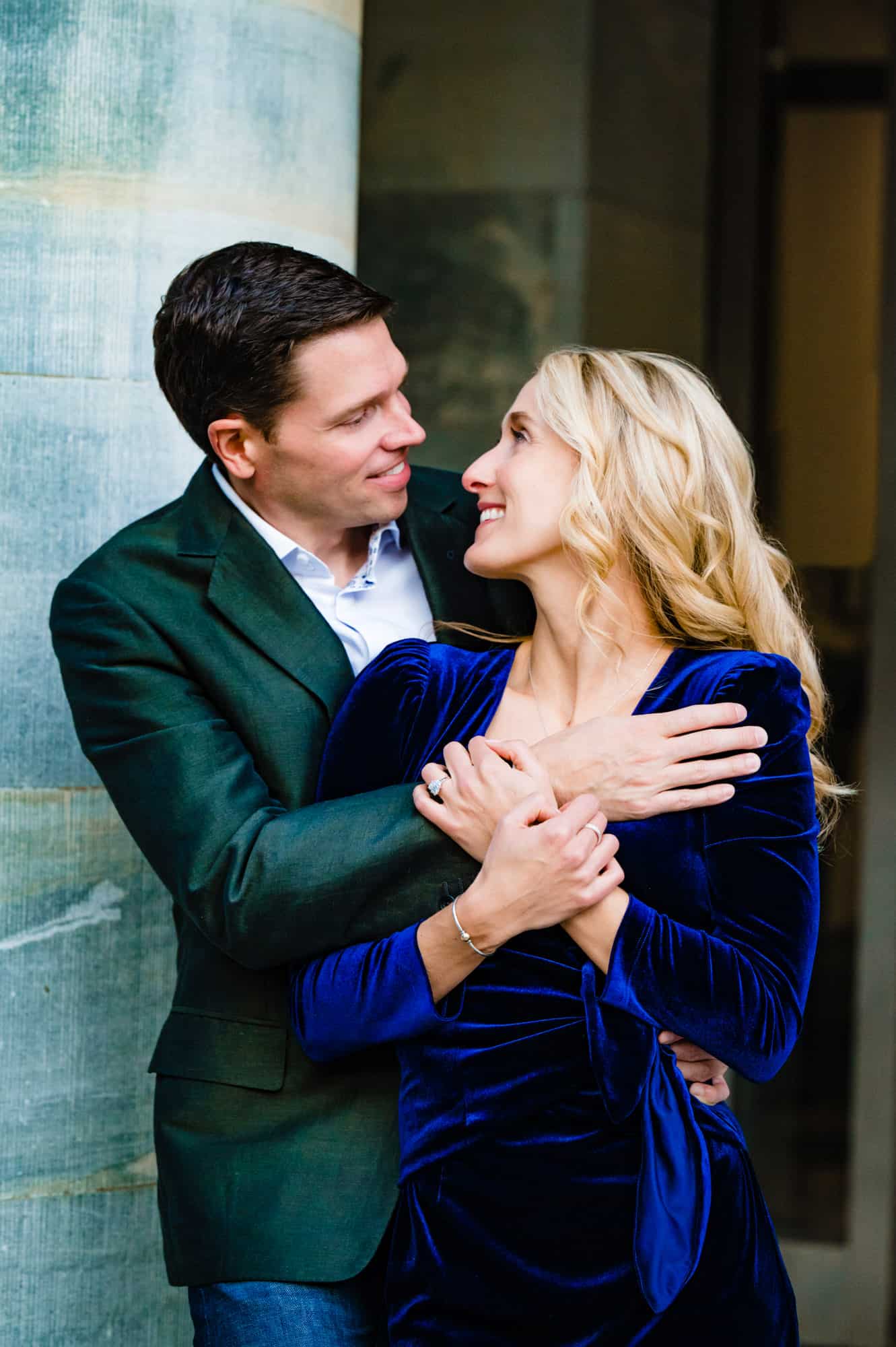 modern couple hugging and looking at each other lovingly during their old city engagement session