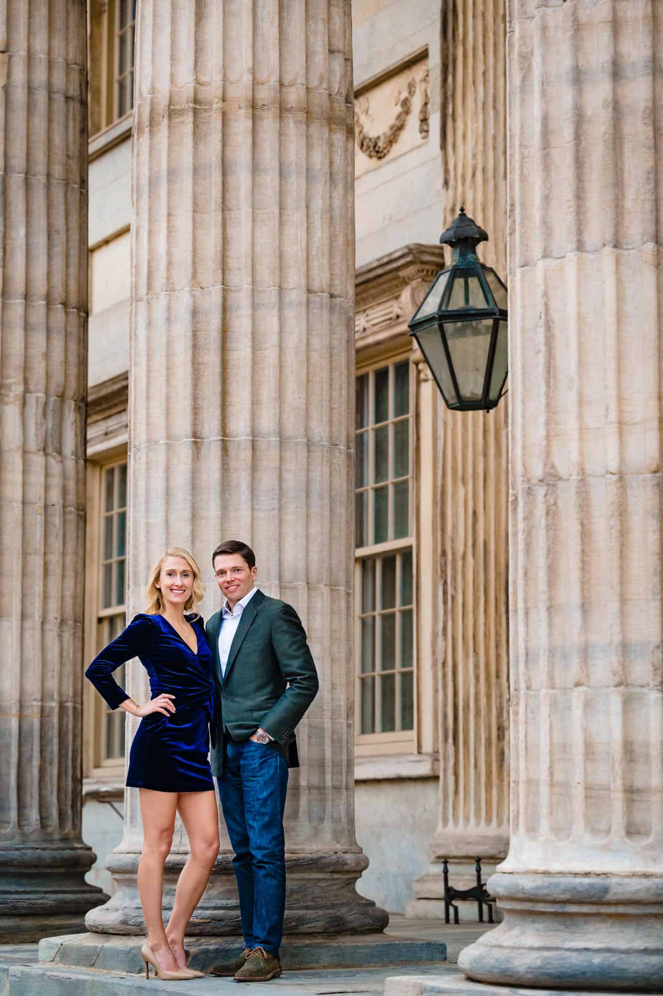 couple poses against the baluster of the 1st Bank of the United States