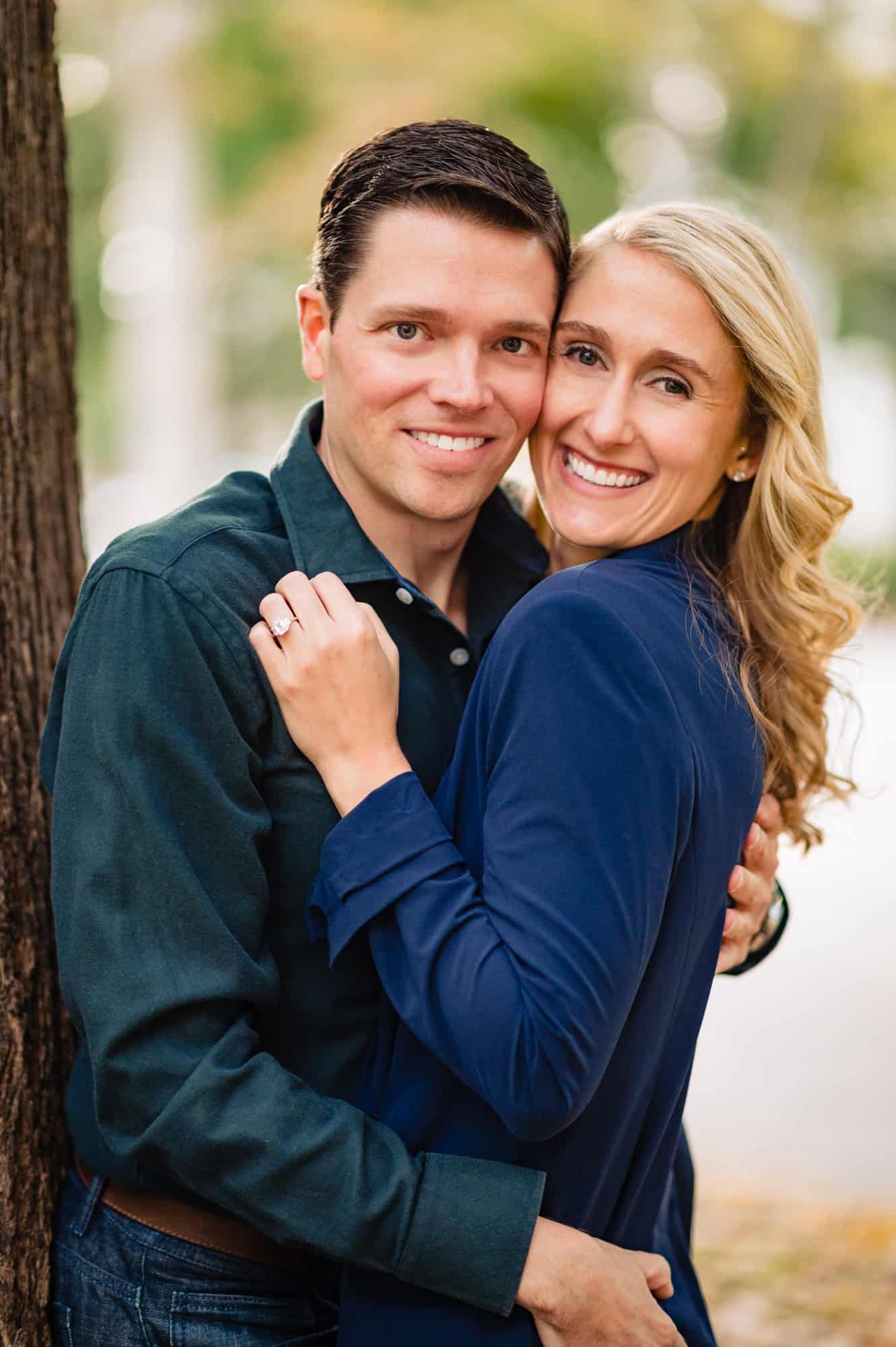radiant couple smiling for the camera during their old city engagement session