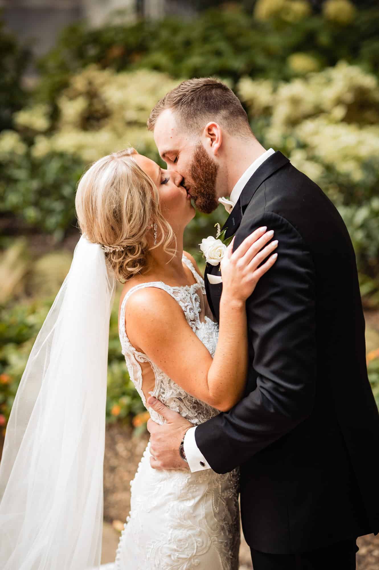 groom kissing his bride during the arts ballroom philadelphia wedding