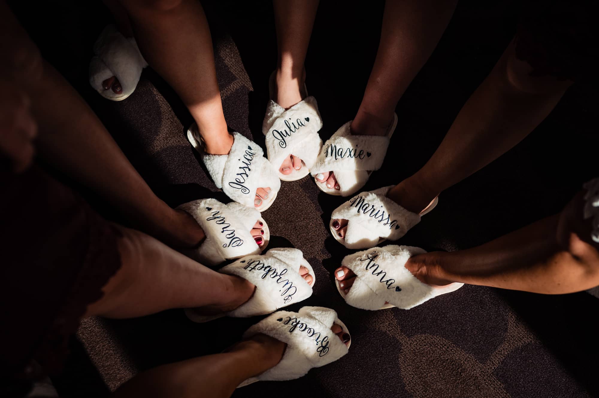 the custom slippers of the bride and bridesmaids