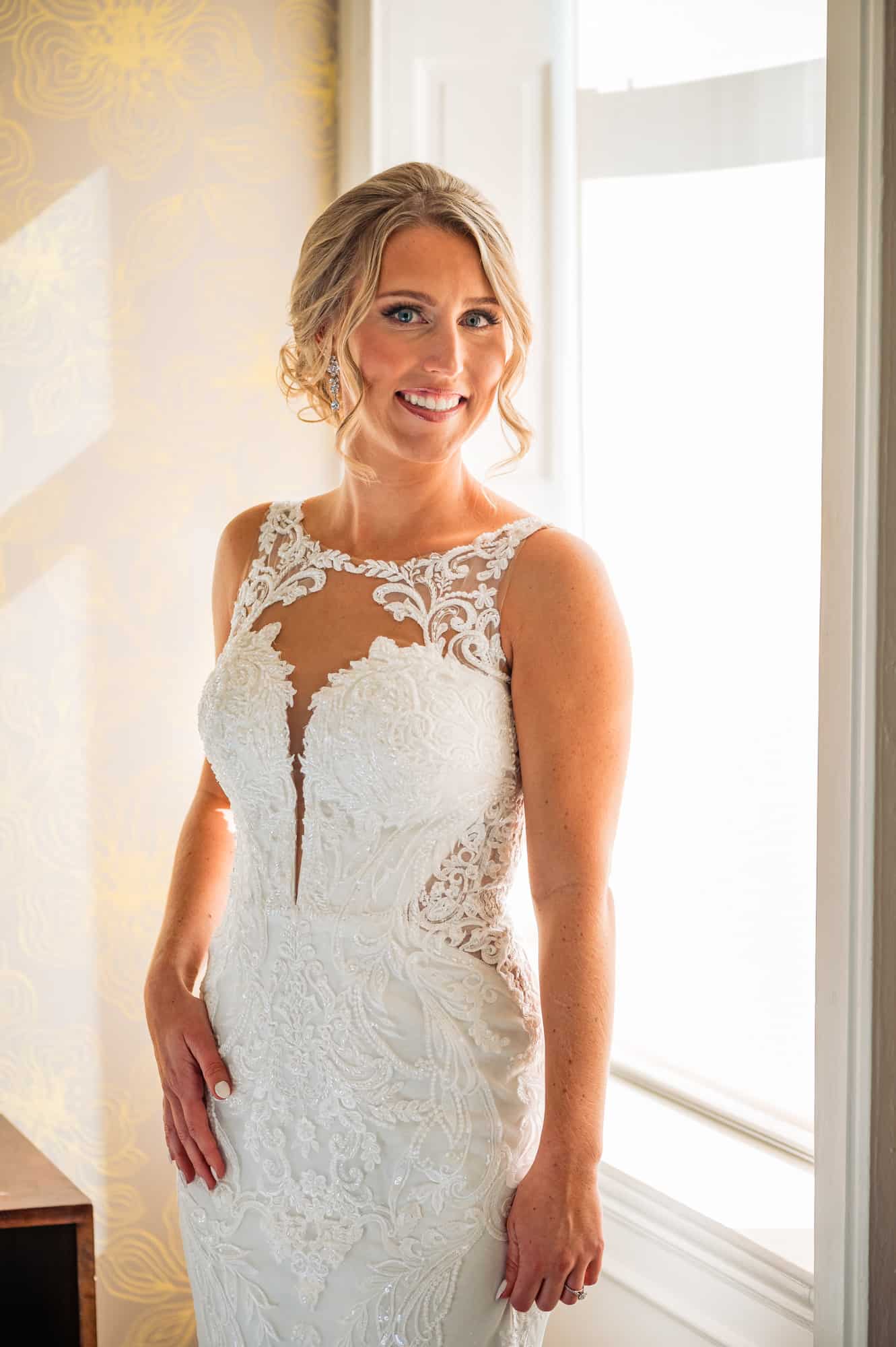 bride smilling near window