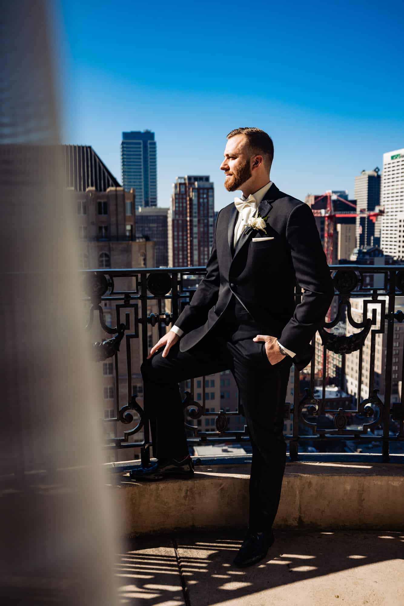 Grooms posing outside the balcony