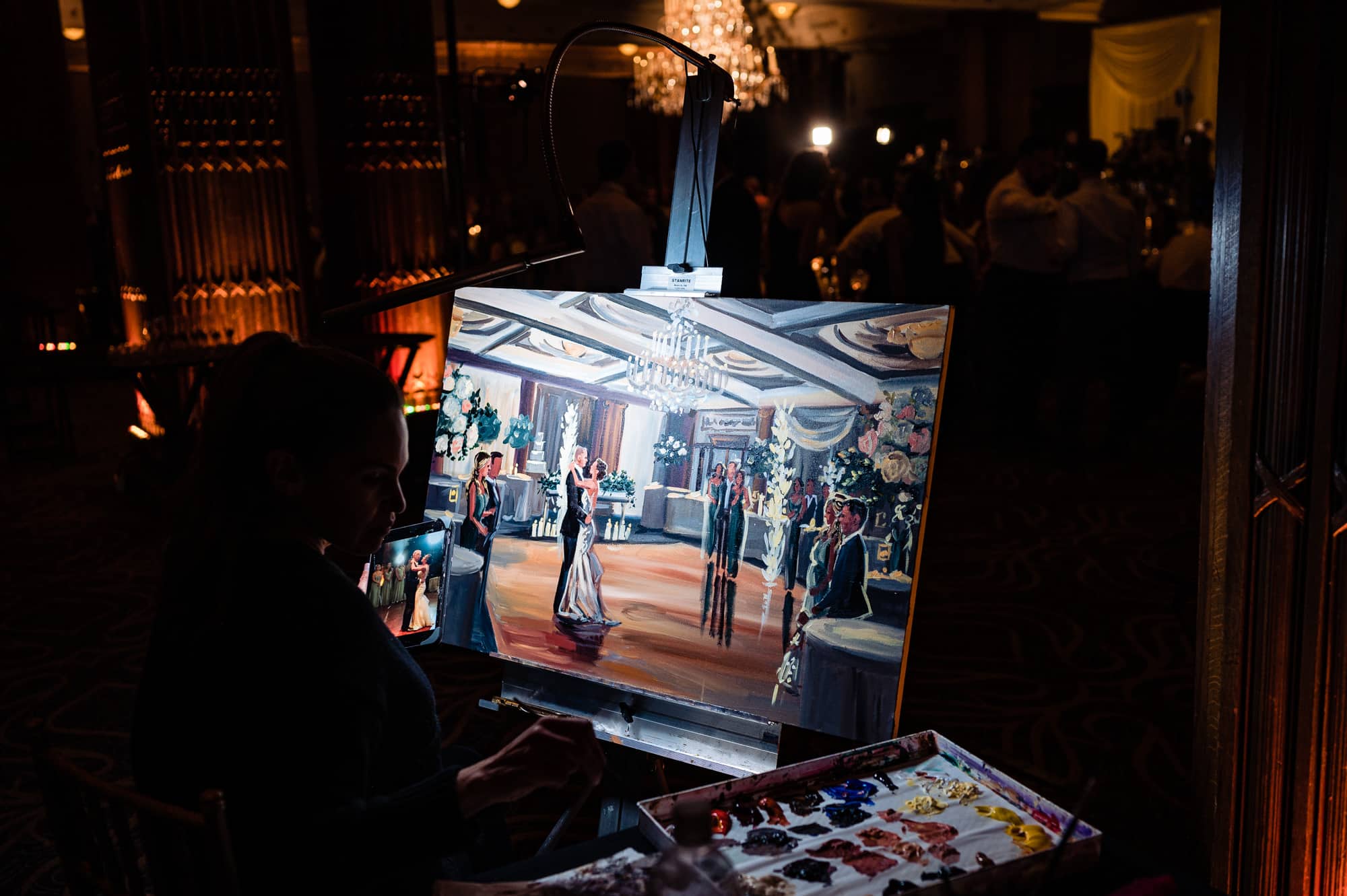 painter painting the newlyweds' first dance