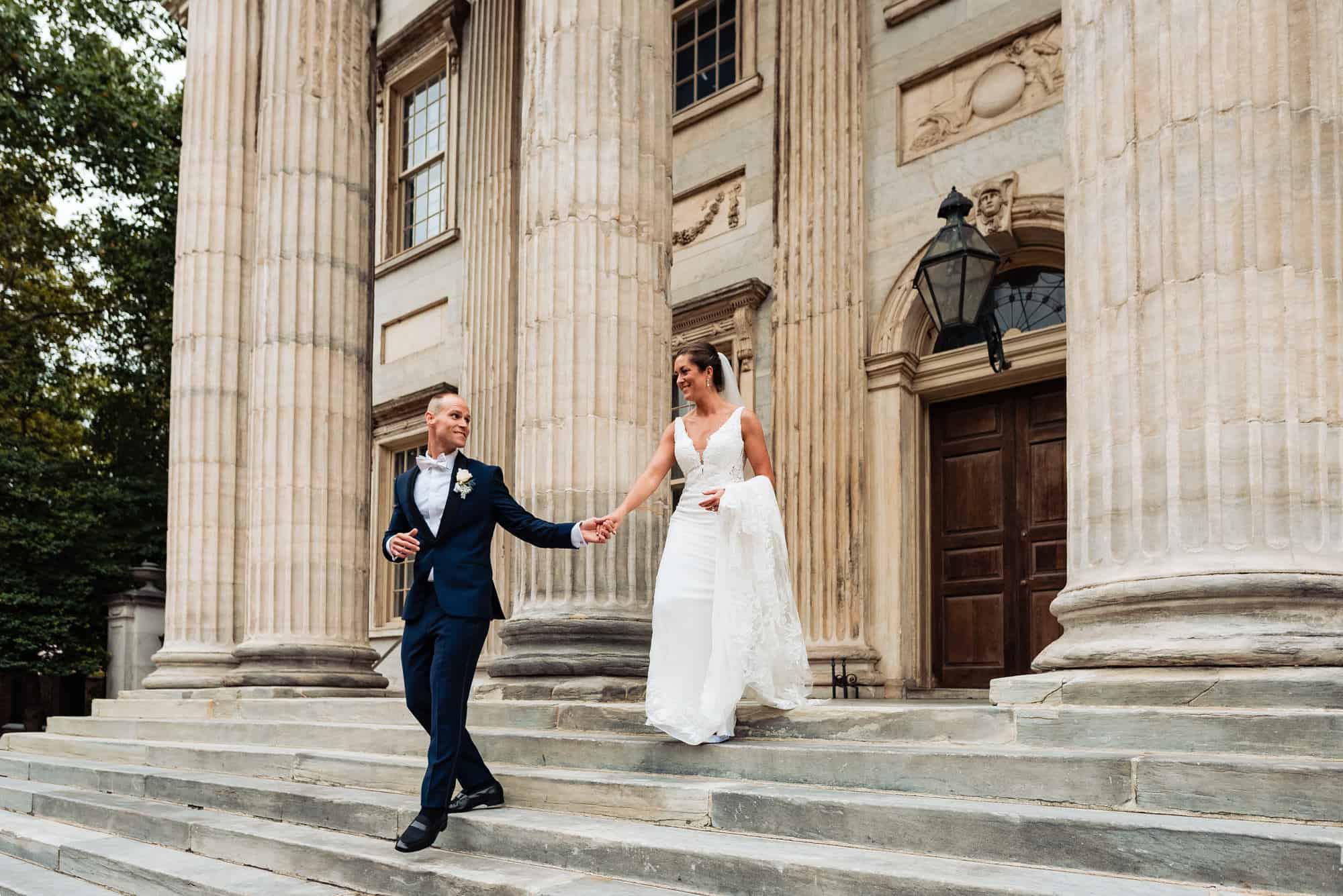 bride and groom going down the stairs