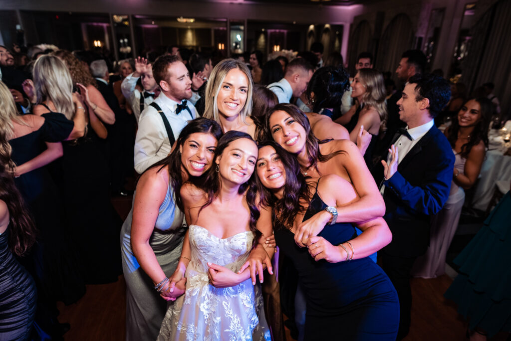 bride and her guests having fun at her wedding reception