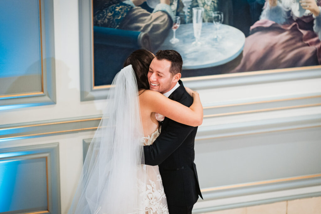 bride and groom hugging after their first look