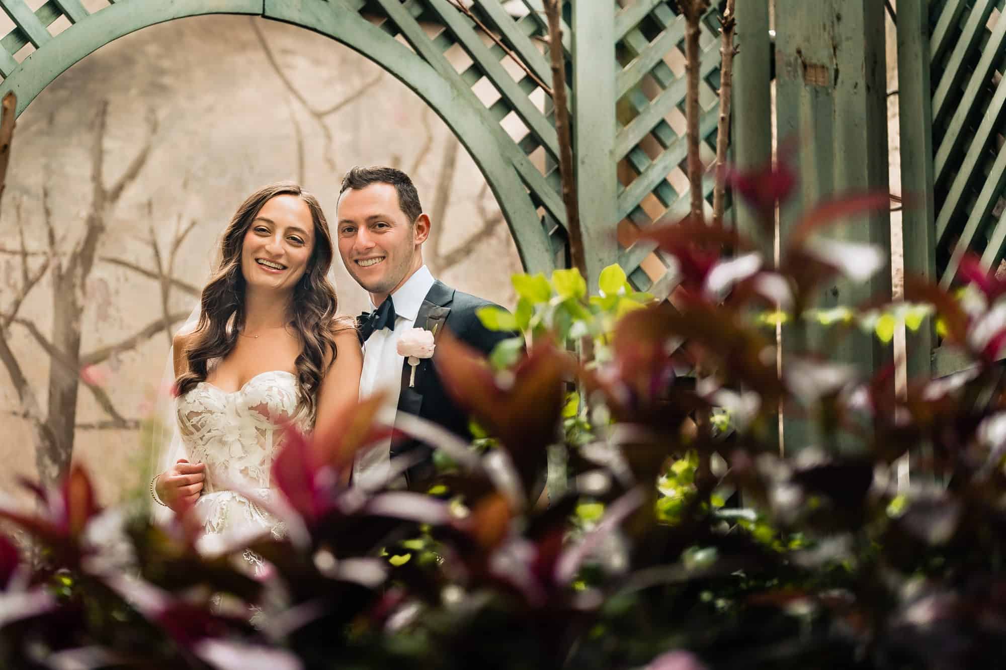 couple take a pose at the rittenhouse hotel's garden