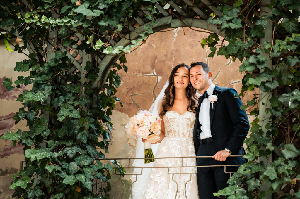 couple take a pose at the rittenhouse hotel's garden
