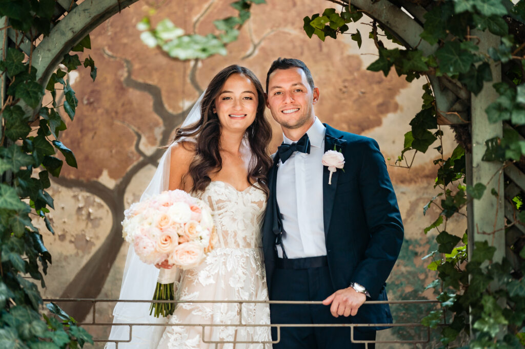 couple take a pose at the rittenhouse hotel's garden