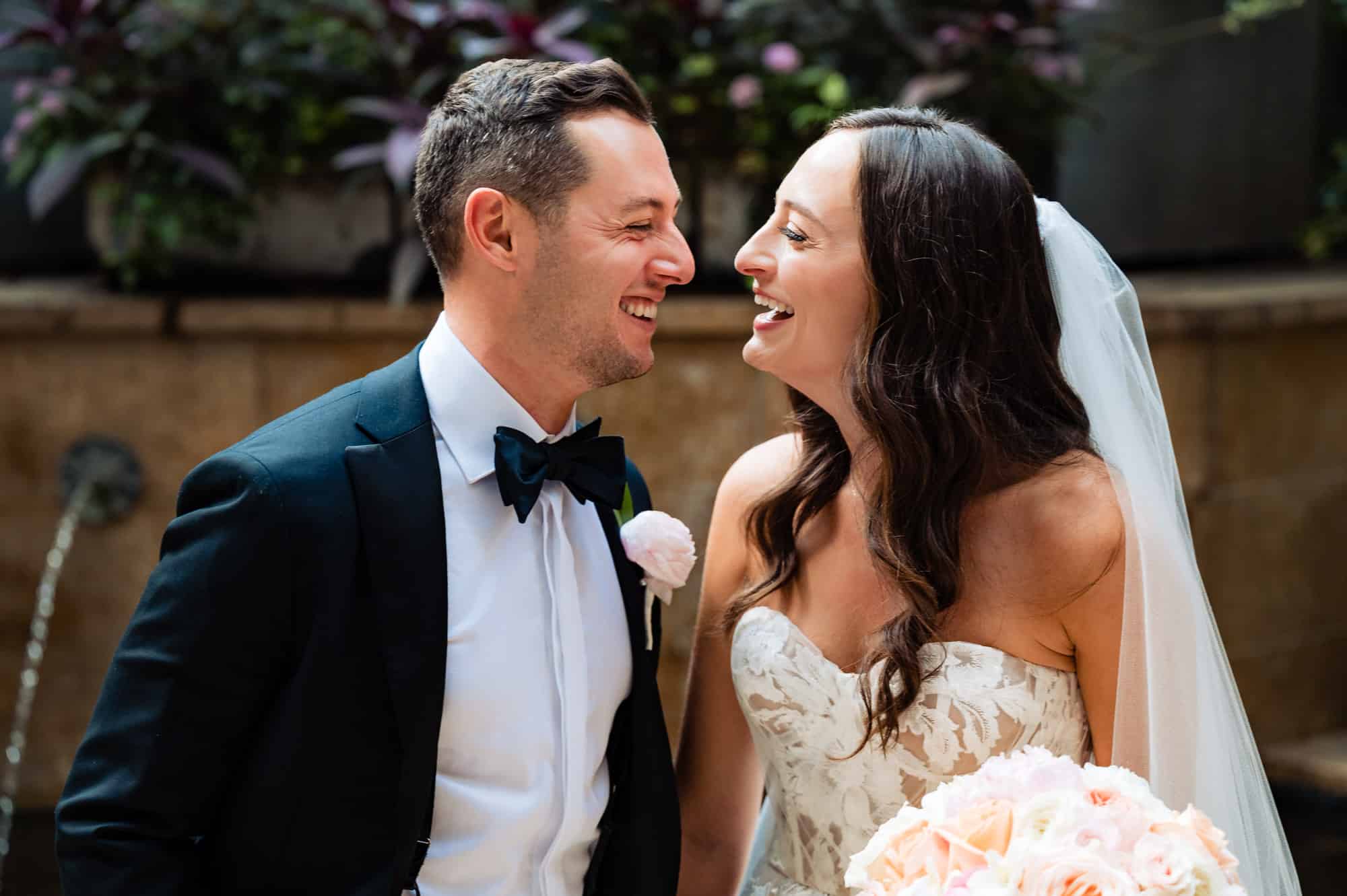 couple smiling at each other during their wedding ceremony