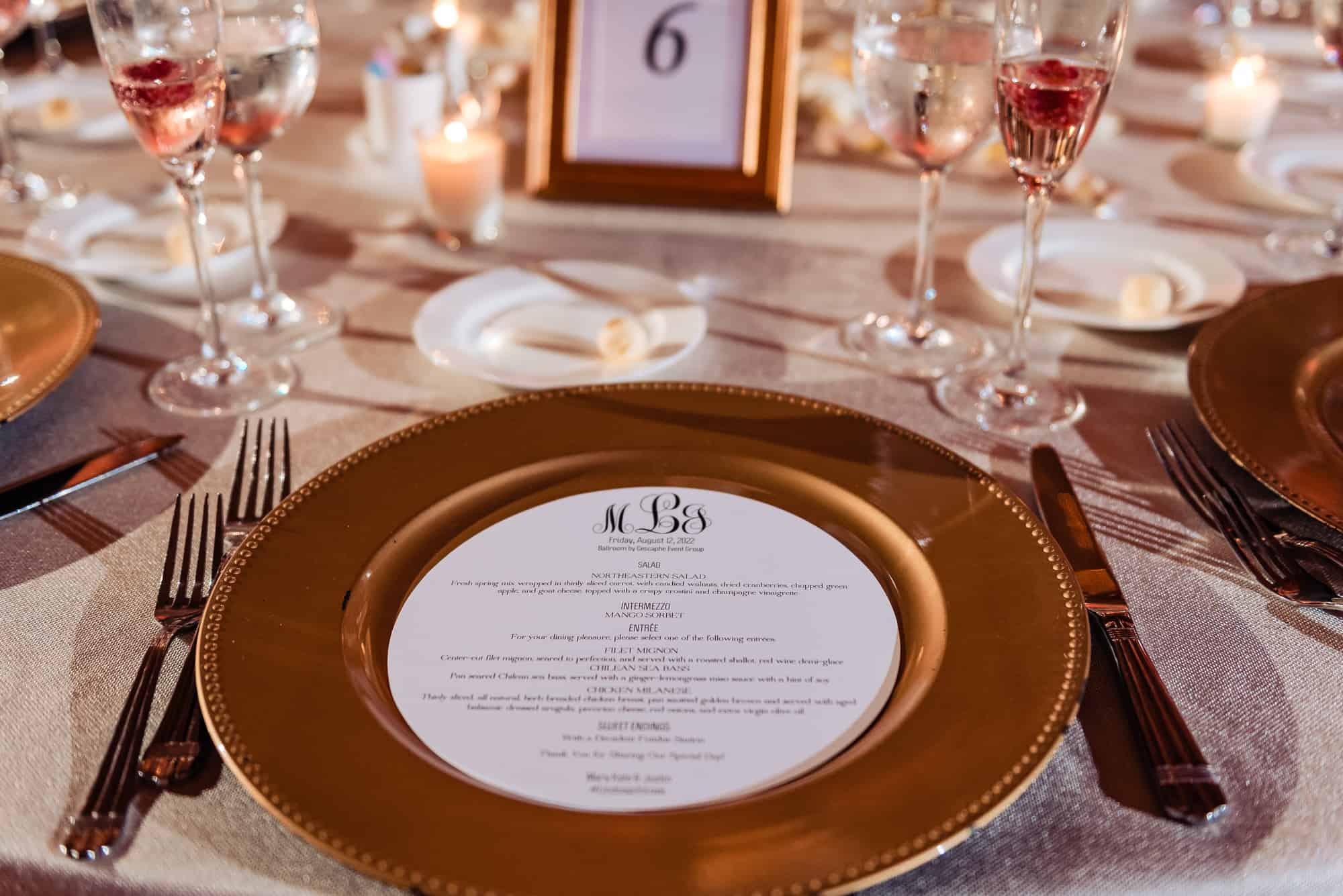 wedding menu is placed on top of plates