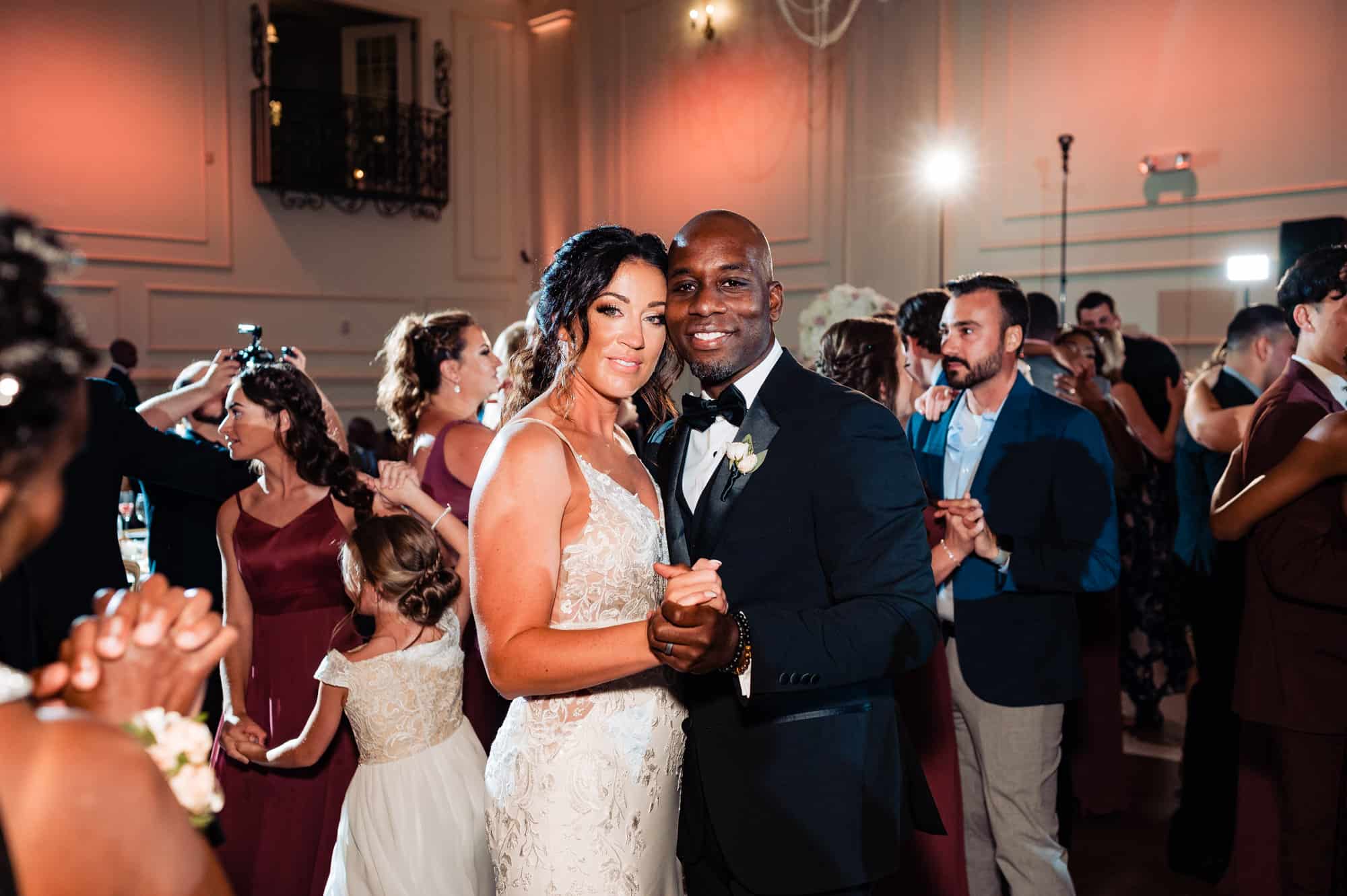 newlyweds takes a pose in the dance floor