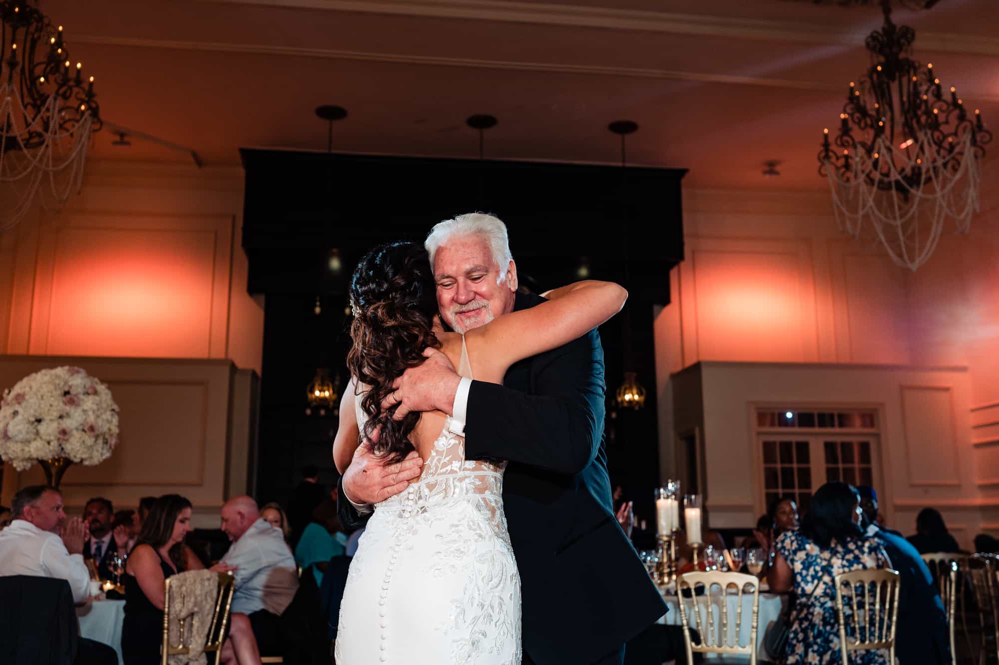 bride hug her father after their dance