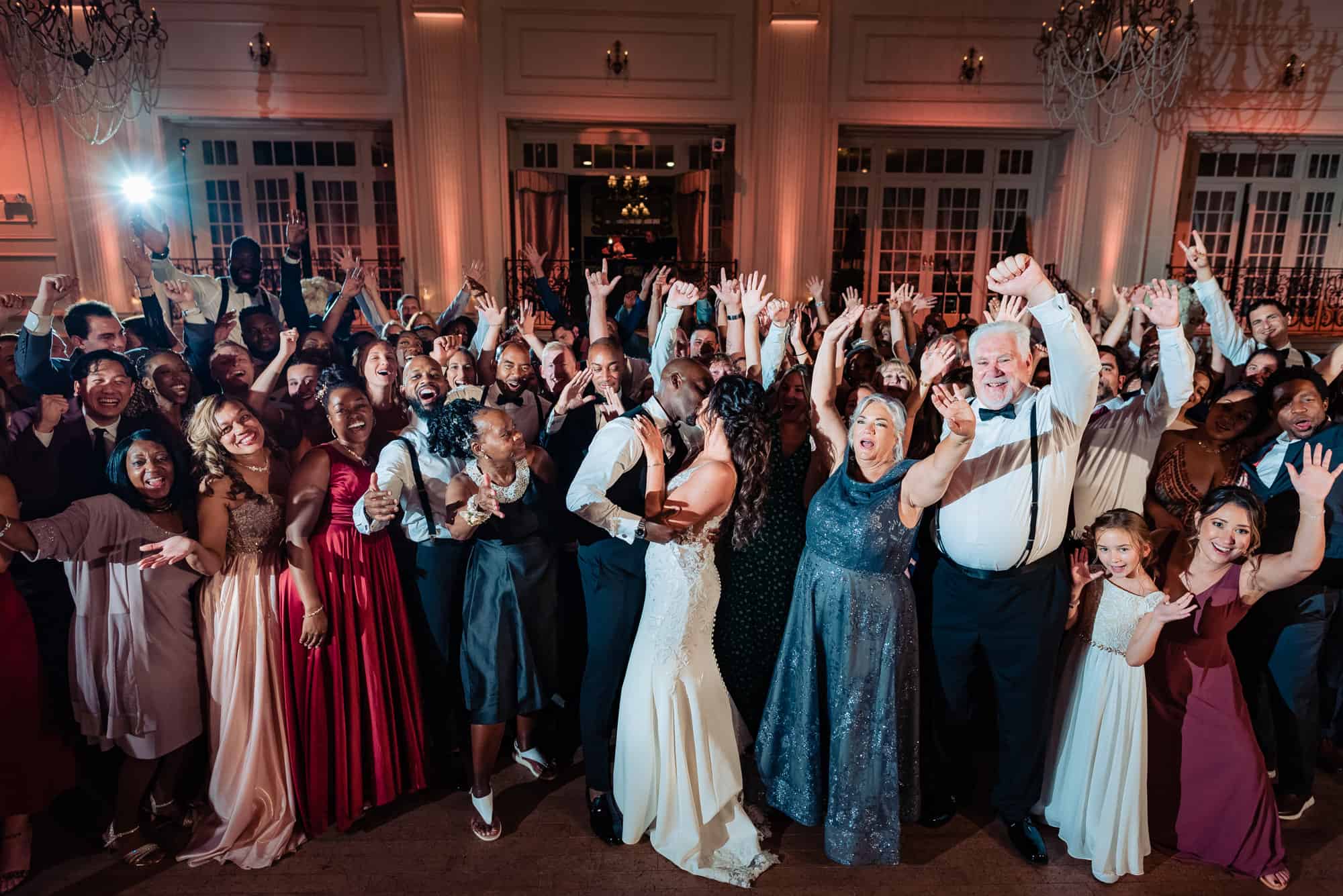 newlyweds kissed while their guests cheered