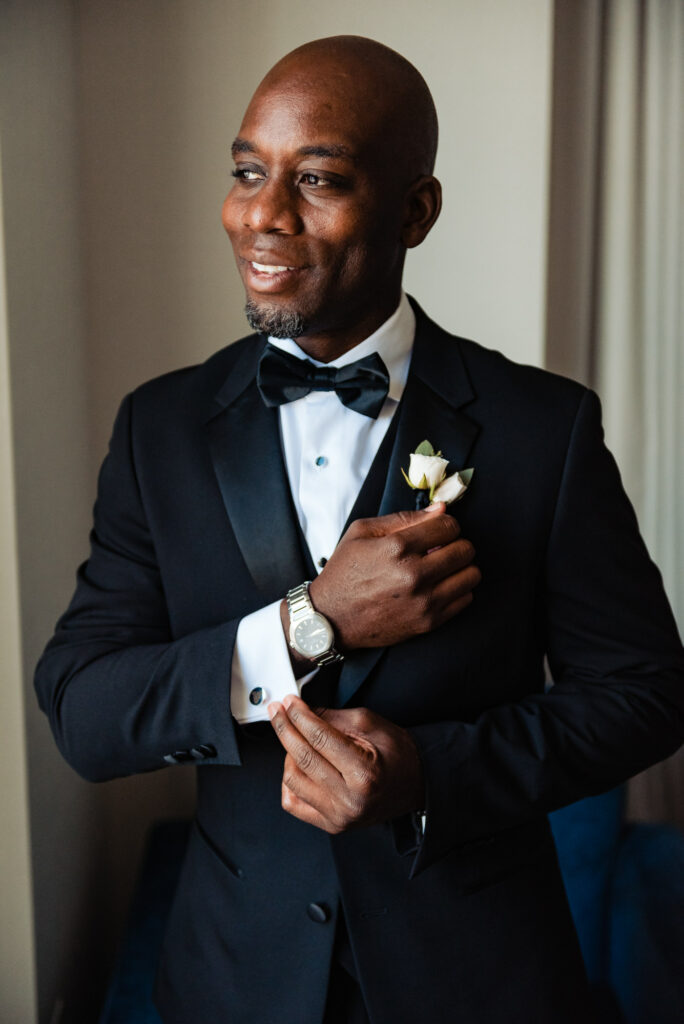 groom takes a candid pose