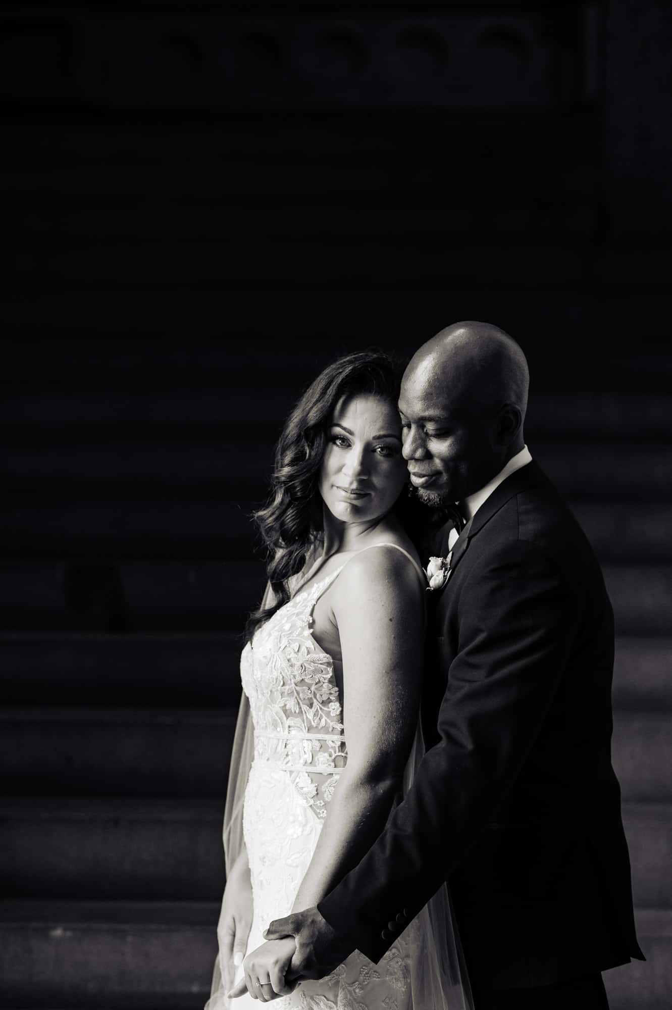 black and white shot of the couple taking a candid pose before their center city wedding at cescaphe ballroom