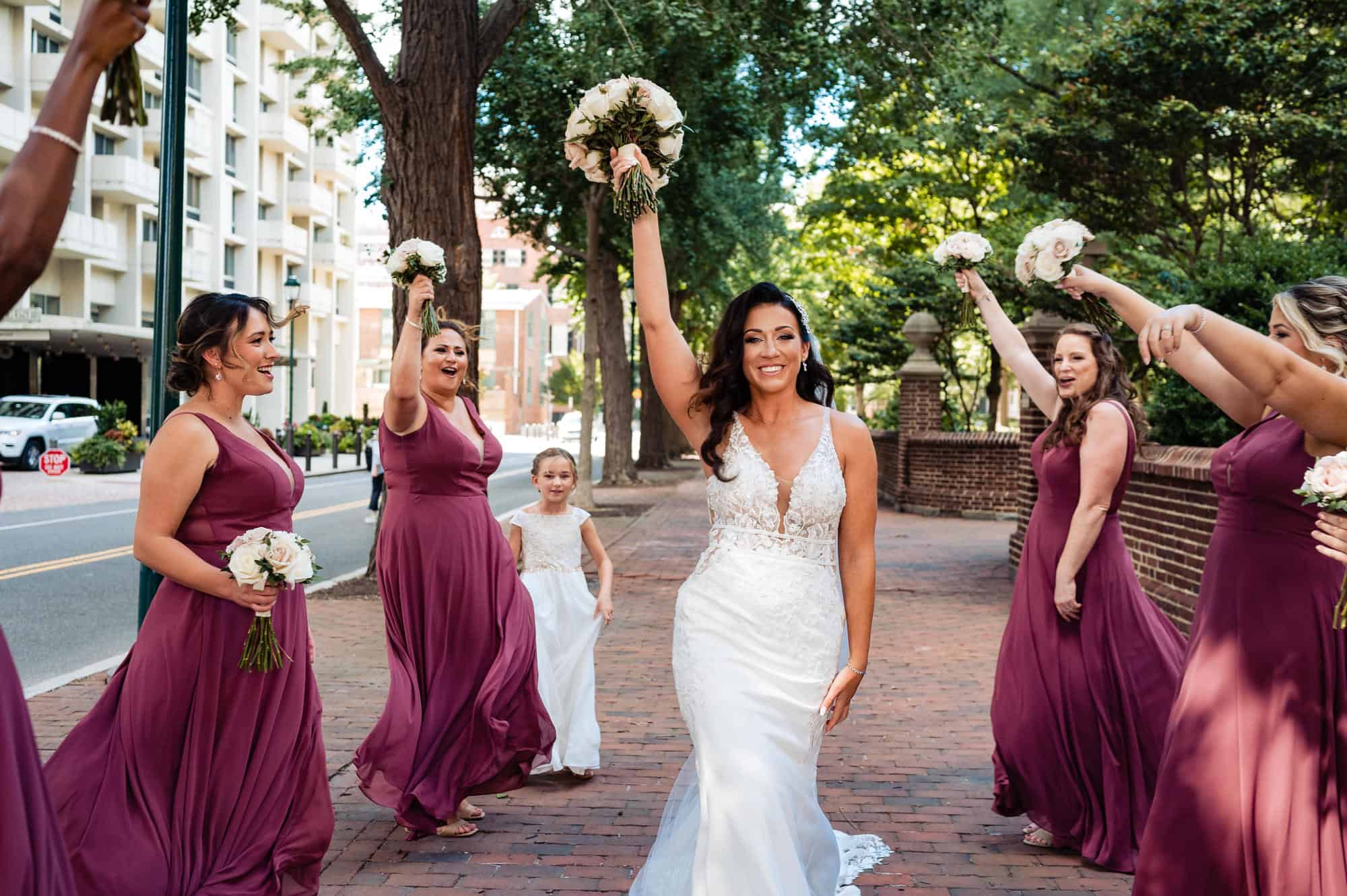 bride is cheered by her bridal party