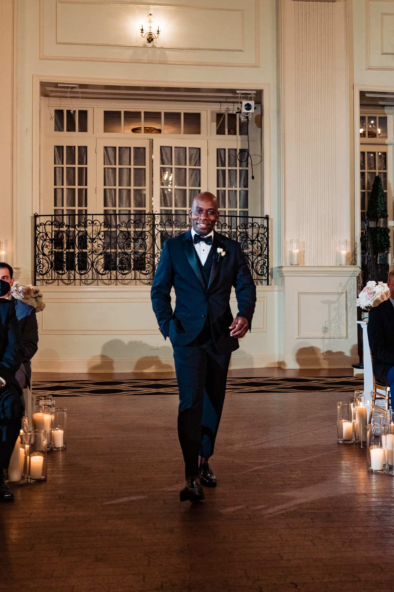 groom walking down the isle