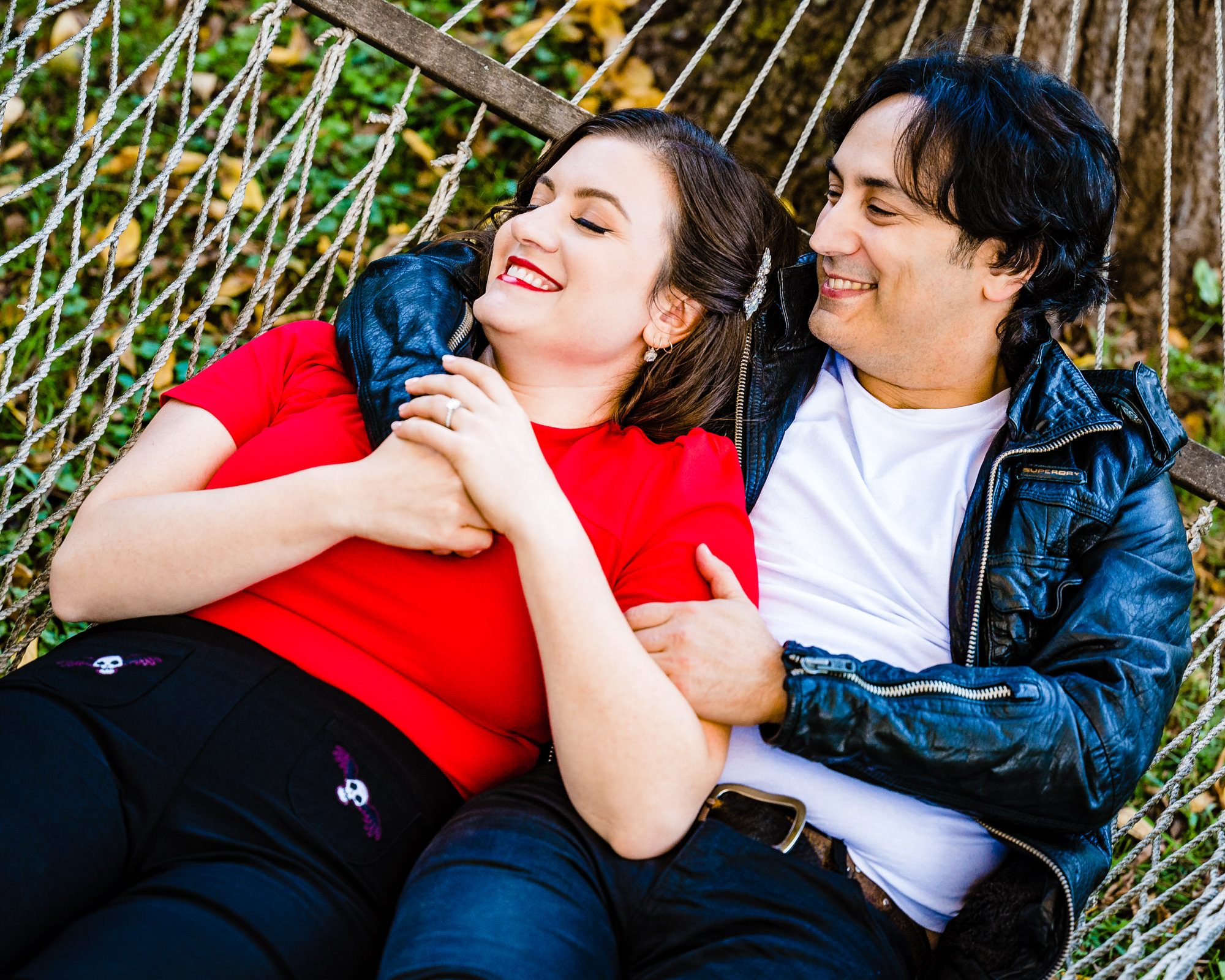 couple having a tender moment on a hammock during their classic engagement photoshoot captured by ralph deal photography